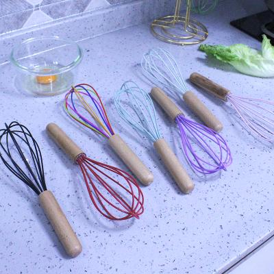 China Kitchen Viable Industrial Silicone Manual Egg Beate With Wooden Handle For Cooking Mixing Beating Beater Stirring for sale