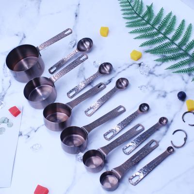 China Unique design 12pcs 201stainless steel copper metal jigger and cup set with non-slip silicone handle in color box for sale