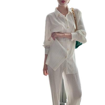 China Anti-pilling 2021 fashionable women's clothing loose long sleeve white buttons tops casual blouse pants two-piece set for sale