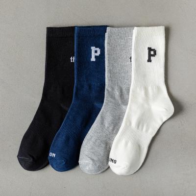 China 2021 Wholesale QUICK DRY custom logo sports designer socks fashion cotton letter socks black and white running socks for men and women for sale