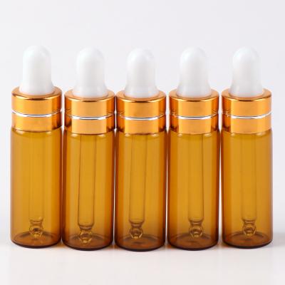 China Cosmetic serum 5ml amber tubular glass bottle with dropper for essential oil perfumes for sale