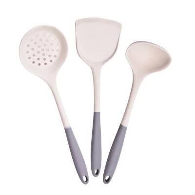 China OEM/ODM Cuchara de cocina multifuncional y juego de espátulas de mango de madera utensilios de silicona en venta