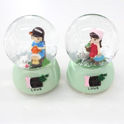 China Europe Souvenir Snow Globe Music Snow Globe Girls Souvenir Water Glass Globe Glass Ball for sale