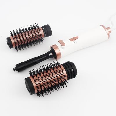 China Ionic HM-310  1000W 3-in-1 Hot Air Spin Brush for Styling and Frizz Control Auto rotating Curling Negative Ionic Curler Hai for sale