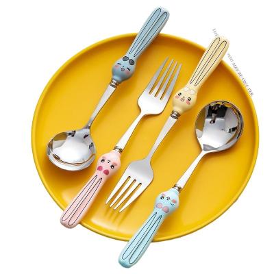 China Nordic Cute Rabbit Ceramic Handle Cartoon Style 304 Stainless Steel Food Spoon Stocked Western Fork for sale