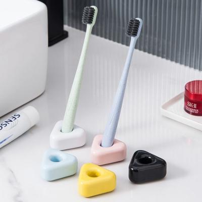 China Viable Creative Triangular Toiletries Household Gift Bathroom Hotel Toothbrush Holder Ceramic Socket for sale