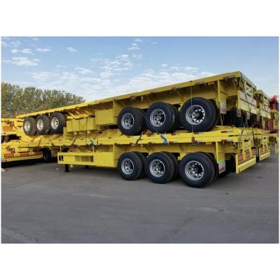 China 12R22.5 40/45ft 60 Tons Flatbed Semi-Trailer Steel Container Flatbed Truck Trailer for sale