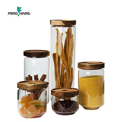 China New Sustainable Clear Round High Borosilicate Glass Canister Food Storage Jar With Acacia Wood Lid for sale