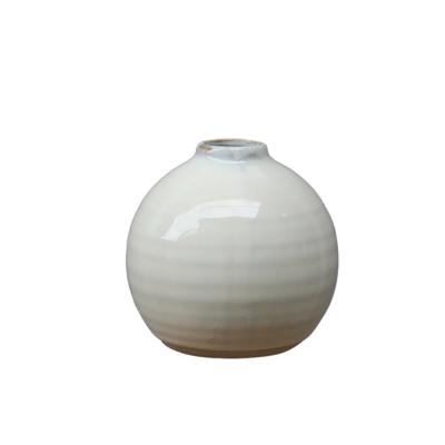 China Simply Natual Clay with White Reactive Luster Round Shape Flower Vase for Home Decor for sale