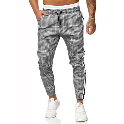 China 2021 Hot Amazon Sale Drawstring Fashion Fitness Sports Jogger Pants Breathable Urban Casual Pants Men's Plaid Tapered Trousers Man for sale