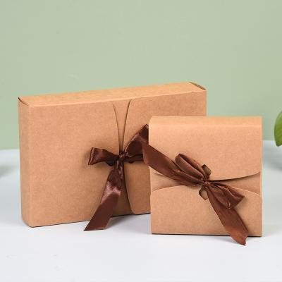 China Recyclable Bow Strap With Hand Folding Gift Candy Box Paper Box Lipstick Ornament Perfume Brown Paper Gift Box for sale