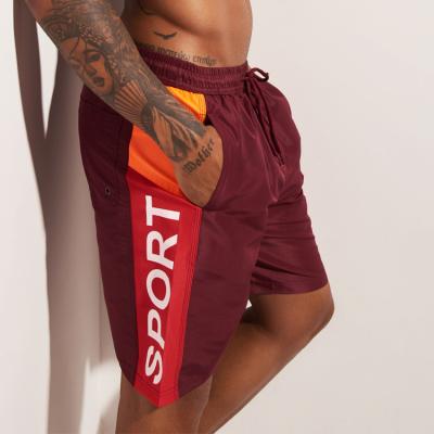 China Custom Windproof Letter Panels Stripe Mens Workout Male Shorts With Side Pockets for sale