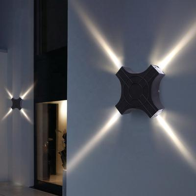 China Stair Project Building Garden and Corridor Wall 12W Cross Star Four Light Beam Wall Light Led Outdoor for sale