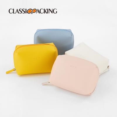 China Fashion BSCI ISO Sedex FAMA Embossed Logo Waterproof Leather Cosmetic Bag Custom Plain Simple Fashion for sale