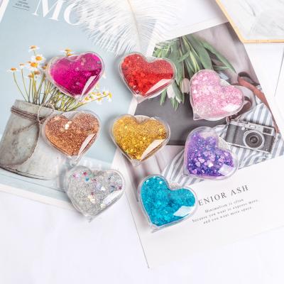 China Universal phone holder heart shape new popular creative gift love quicksand liquid full of star bubbles for sale