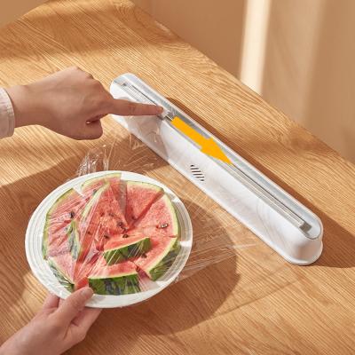 China Sustainable Plastic Food Wrap Dispenser With Adjustable Slide Cutter Cling Film Cutter Preservation Foil Storage Box With Suction Bottom for sale