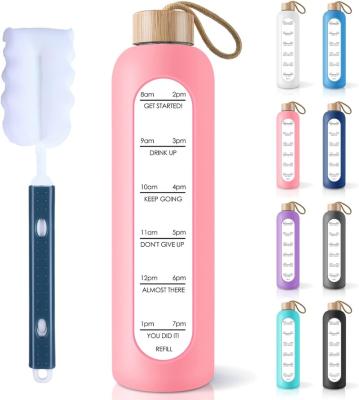 China Sustainable 32 oz Glass Water Bottle with Straw Lid, Time Marker Sleeve & Extra Lid  Motivational Wide Mouth Glass Drinking Bottles for sale