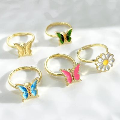 China BS1106 CLASSIC Creative Enamel Dripping Oil Butterfly Flower Rings Adjustable Aperture Moving Person Rotating Rings For Worry for sale