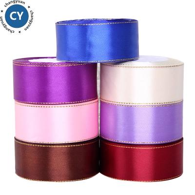 China Wholesale 100% Recyled Polyester 38mm Face Stock Double Gold Edged Satin Ribbon for sale