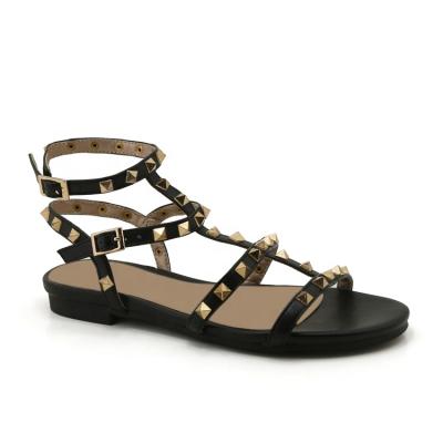 China Fashion trend padded trendy woman metallic sandals with ankle strap and pyramid buckle accessories for sale