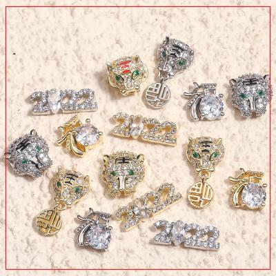 China Luxury Nail Charms Supplies Salon Year New Lucky Tiger 2022 Where Fake Nail Art Stone Charms Zircon Jewelry for sale