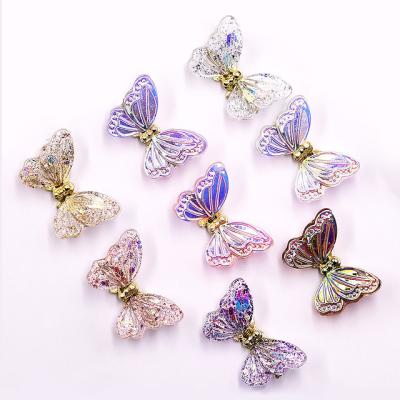 China Luxury Nail Charms New Metal Decoration Rotating Aurora Gold 3D Resin Nail Art Butterfly Charms for sale