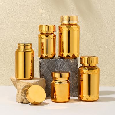 China Medicine CUSTOM Plastic Empty Medicine Capsules Refillable Bottle Plating Gold Silver Convenient Tablets Capsule Pills Packing Container for sale