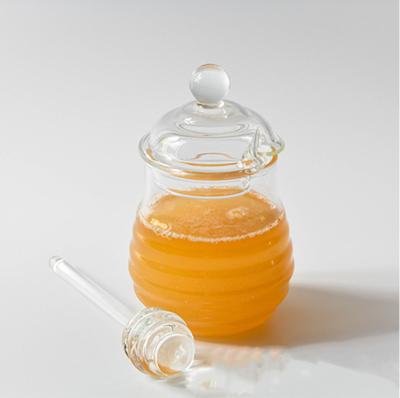 China Customized Viable Wholesale 100ml 220ml Empty Clear Glass Honey Jar With Glass Lid And Dipper for sale