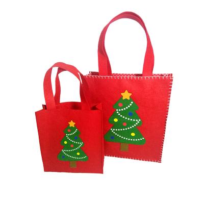 China Factory Direct Sales Decorative Polychromatic Felt Gift Bags With Ribbon Handles For Christmas Decoration Supplies for sale