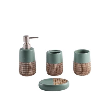 China Vertical Stripe Sustainable Design Fashion Lotion Dispenser 4Pcs Luxury Ceramic Full Bathroom Accessory Set for sale