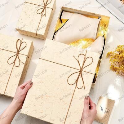 China Recycled Materials Custom luxury clothing jewelry perfume shoes gifting cardboard lid and base rope bowtie birthday box with logo for packaging box for sale