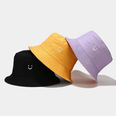 China Sunshade Custom Design Solid Color Embroidery Smiling Bucket Hat Outdoor Sports Fisherman Hat Travel Wearing Casual Double Sided Bucket Hat for sale