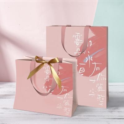 China Recyclable Custom White Fashion Logo Printing Luxury Small Pink Retail Gift Shopping Paper Bags With Ribbon Handle for sale