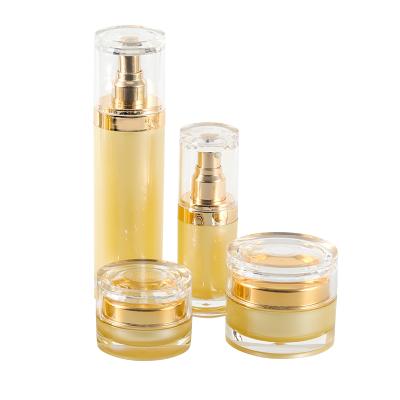 China Wholesale Gold Acrylic Type Personal Factory Skin Care Rotary Switch Packaging Container Cosmetic Lotion Cream Bottle Set Jar Packaging for sale