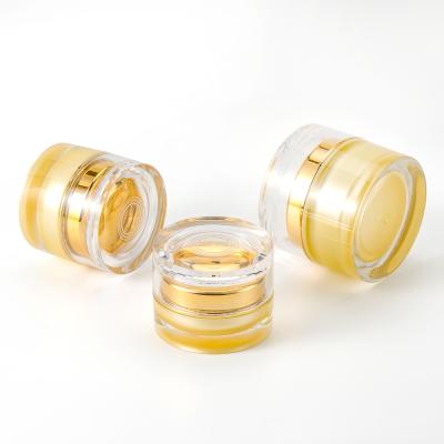 China Luxury Cosmetic Packaging Container Gold Acrylic Cosmetic Packaging Lotion Bottle And Cream Jar Set for sale