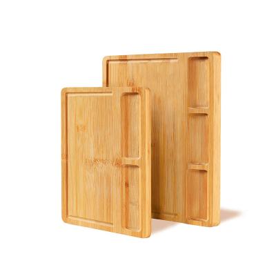 China Disposable organic bamboo cutting board for the kitchen with 2 built-in heavy-duty chopper compartments and juice flutes for sale