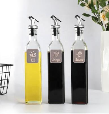 China Sustainable Glass Olive Oil Bottle With Non-Drip Spout And Stainless Steel Label Dressing Set for sale