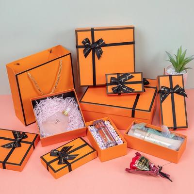 China Disposable Cardboard Lid Luxury Custom Box Orange Gift Box With Ribbon for sale