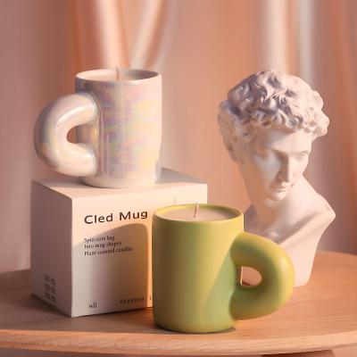 China Home Decoration Best Selling Unique Design Cheap Tealight Ceramic Candle Holder Cup Tea Light Holder With Handle for sale