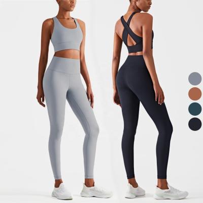 China Breathable Women Cross Back Lift Up Energy Bra High Waist Line Up Workout Fitness Leggings 2 Piece Yoga Set for sale