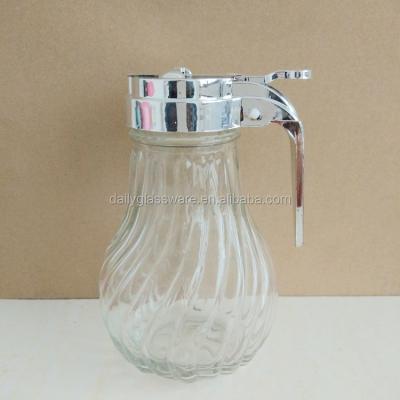 China Sustainable Daily Glass Jar With Handle Lid Honey Dispenser for sale