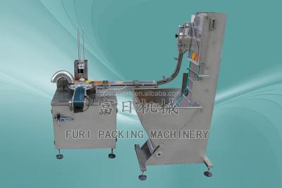 China Inserting Precut Foil Seal Liners Into Caps Cap Lining Machine for sale