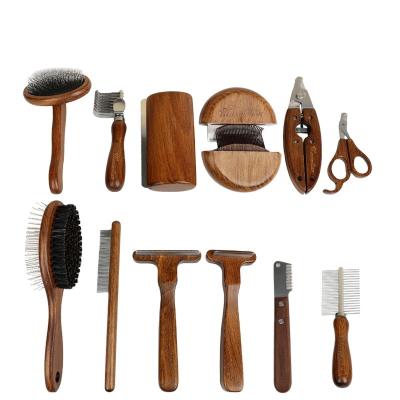 China Sustainable Wholesale custom LOGO pet dog hair removal comb wooden handle brush comb massage brush nail clipper pet grooming tools set for sale