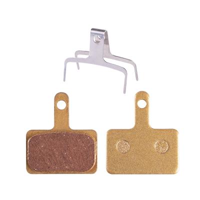 China Mountain Bike Bicycle MTB Accessories Copper Bicycle Wear Resistance Base Metal Less Noise Oil Disc Brake Pads for sale