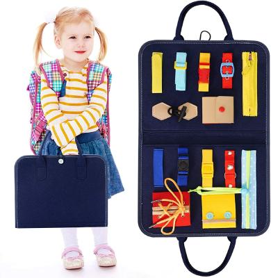 China Funny Educational Toy Kid Dress Learning Toddler Montessori Busy Board Toys For Toddlers 14 Pcs Foldable Sensory Toys Autism Toys Bag Desgin for sale