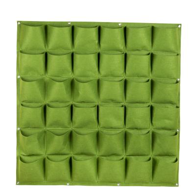 China Amazon Eco-friendly Hot Selling Held Vertical Planter 36 Pocket Wall Hanging Grow Bag Vertical Garden Wall Felt Bag for sale