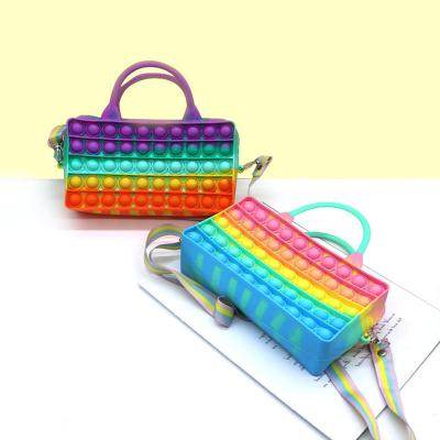 China Cute sweet fashion style silicone compression bag pop it purses purses and purse pop it purses for kids for sale