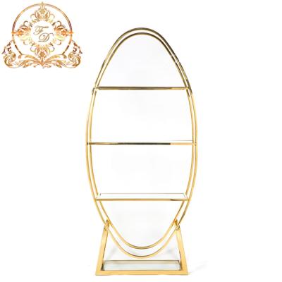 China Morden Party Furniture Gold Stainless Steel Oval Frame With Clear Glass Back Bar Display Wine Shelf for sale