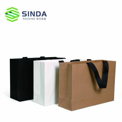 China Recycled Materials Customized Logo Kraft Paper Bag With Handle For Shopping for sale