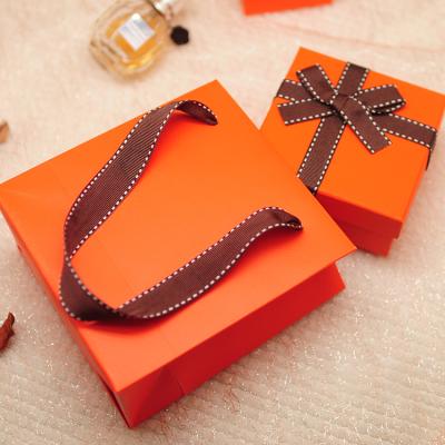 China Custom Materials Luxury Jewelry Ribbon Handle Recycled Romantic Paper Gift Bag for sale